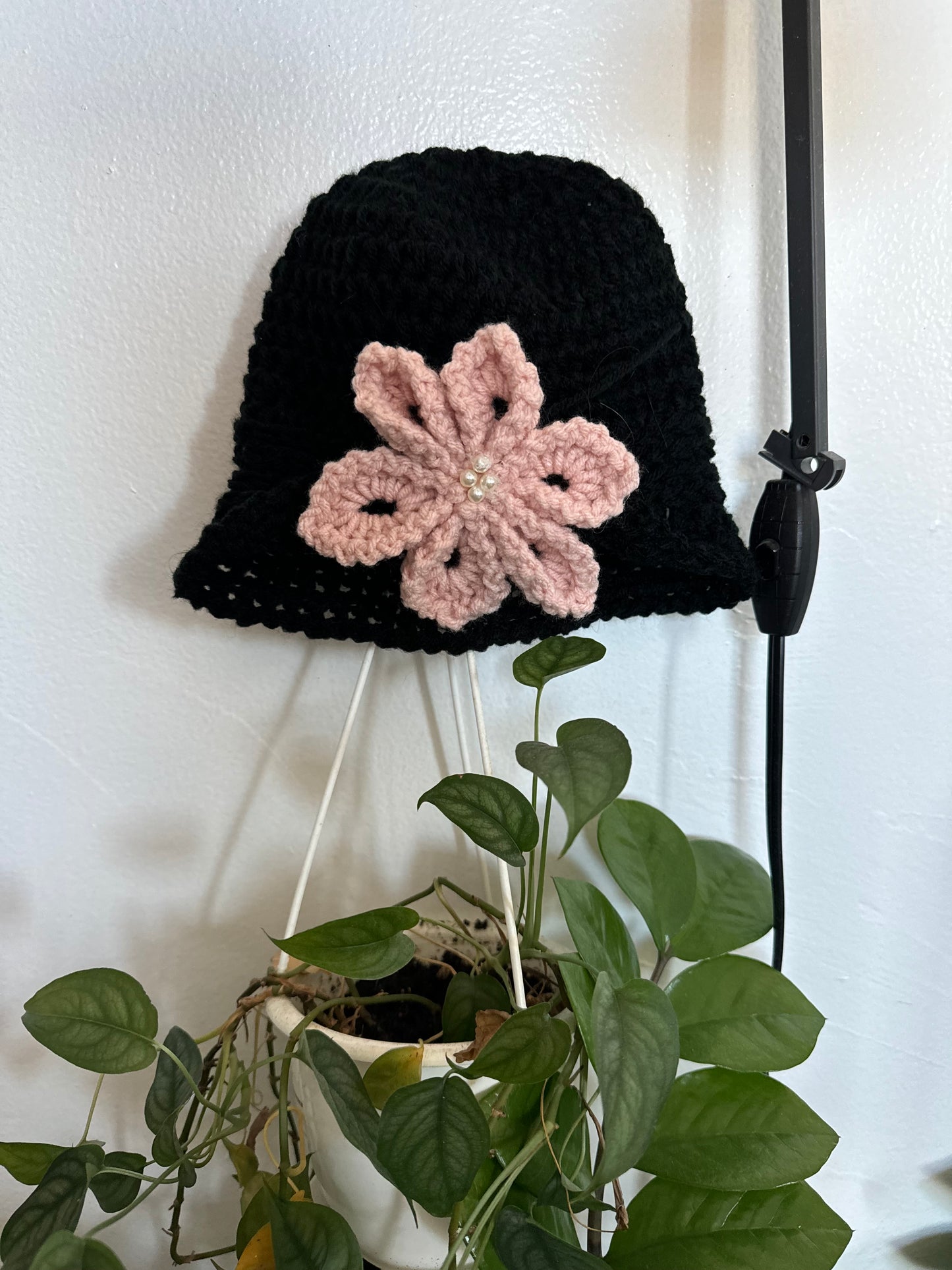 Black hat pink flower